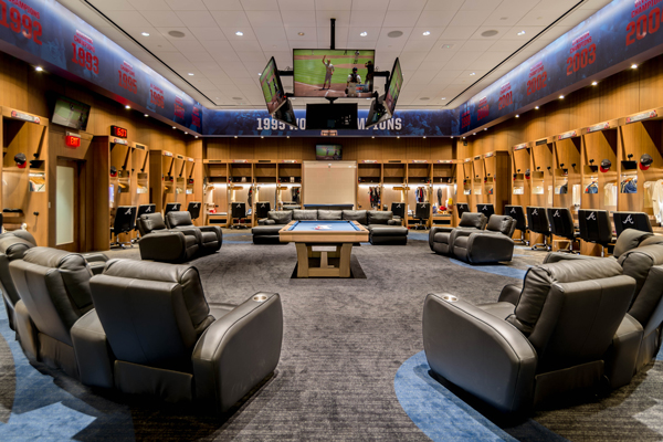 Custom design including millwork, lighting, and furniture placement for a high end locker room / stadium space